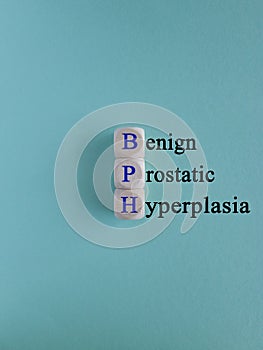 Medical and BPH, Benign Prostatic Hyperplasia symbol. Wooden cubes with the blue word \'BPH\'