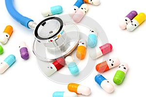 Medical capsules and pills with happy smiling faces on white background