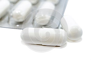 Medical capsules, pills on a white background close-up. Medical drug. Health. Treatment