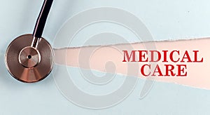 MEDICAL CARE word made on torn paper, medical concept background