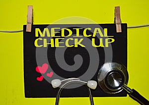 MEDICAL CHECK UP on top of yellow background