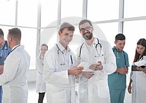 Medical colleagues standing in the lobby of the clinic.