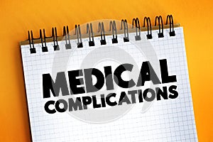 Medical Complications text quote on notepad, concept background