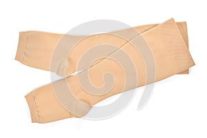 Medical compression stockings on white background.