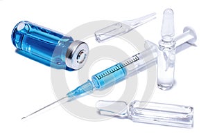 Medical concept: ampules, phial and syringe with blue vaccine