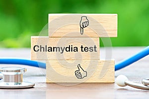 Medical concept. Chlamydia Test text on wooden blocks on a green background