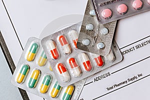 Medical concept flat lay with pills, medical prescription on the doctor desktop