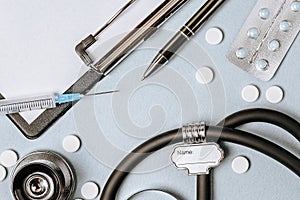 Medical concept flat lay with stethoscope  pills  notepad  pen on the doctor desktop