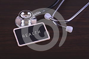 Medical Concept-Health words written on label tag with Stethoscope