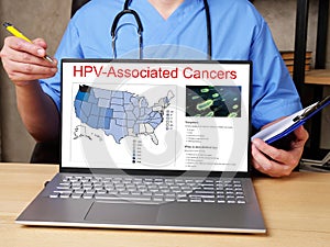 Medical concept about HPV-Associated Cancers  with sign on the sheet photo