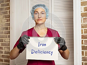 Medical concept about Iron Deficiency with phrase on the piece of paper