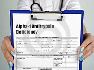 Medical concept meaning Alpha-1 Antitrypsin Deficiency with inscription on the piece of paper photo