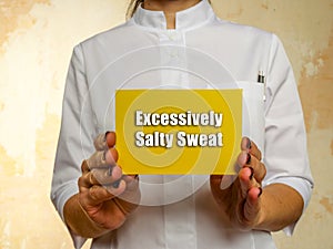 Medical concept meaning Excessively Salty Sweat with phrase on the piece of paper photo