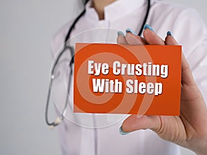 Medical concept meaning Eye Crusting With Sleep with phrase on the page photo