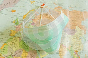 Of medical Concept during Pandemia. Pattern of medical masks on map background photo