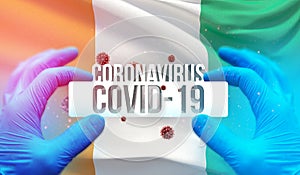 Medical Concept of pandemic Coronavirus COVID-19 outbreak with backgroung of waving national flag of Cote Ivoire
