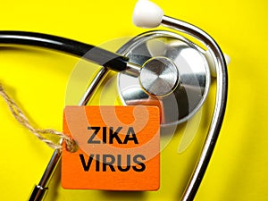 Medical concept.Word ZIKA VIRUS on wooden board with stethoscope.