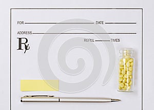 Medical concept. Yellow pills with pills, notepad, medical prescription on the doctor`s desktop. Treating a patient in a hospital