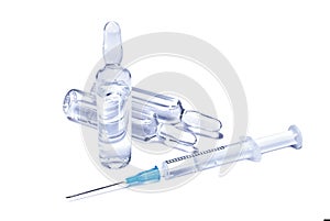 Medical conception: ampules and syringe with transparent vaccine