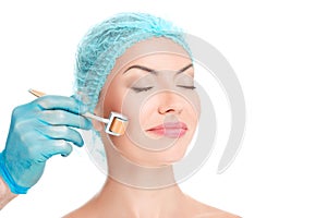 Young beautiful woman having an injection mesotherapy