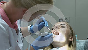Medical dentist procedure of teeth polishing with cleaning from dental deposit and odontolith