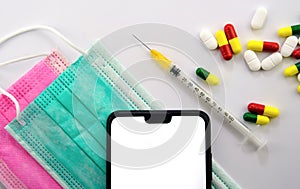 Medical design template with copy space. Viral masks, smatrphone, syringe and pills