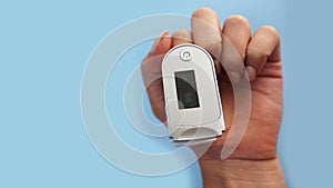 Medical device for hypoxia. Female finger in a pulse oximeter
