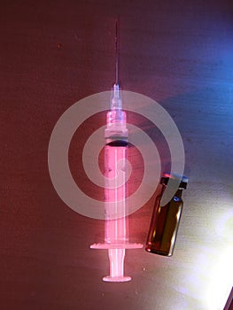 Medical device for injecting and a bottle filled with medicinal liquid