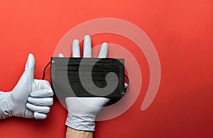 Medical disposal, lab gloves - Virus protection equipment on red background. Infections prevention CoronaVirus pandemic protection