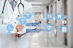 Medical Doctor and ANTIBIOTIC RESISTANCE words in Medical network connection on the virtual screen on hospital background photo