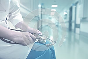 Medical doctor in empty hospital corridor