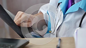 Medical doctor examining the MRI scan of the patient