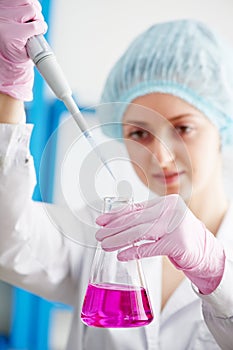 Medical doctor with flask dropper in a laboratory