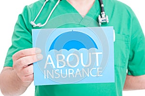 Medical doctor holding paper with information about insurance