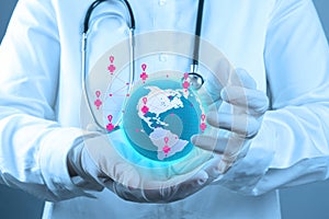 Medical Doctor holding a world globe in his hands