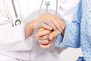 Medical doctor holing senior patient's hand