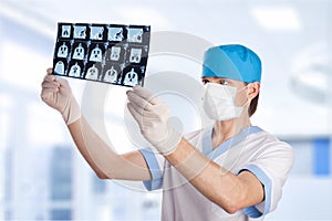 Medical doctor looking at tomography scan image
