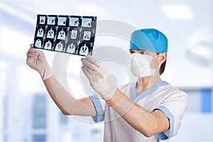 Medical doctor looking at tomography scan image