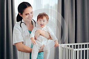 Medical Doctor Making Home Visit Holding Baby Infant