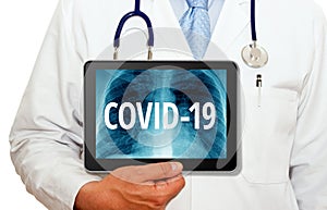 Medical doctor or physician with covid-19 tablet pc photo