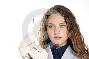 Medical doctor removes the air from the syringe and injection