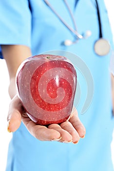 Medical doctor showing apple