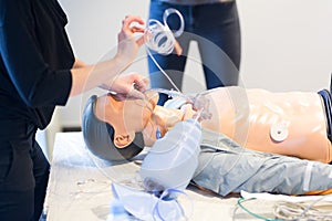 Medical doctor specialist expert displaying method of patient intubation technique on hands on medical education