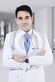 Medical doctor standing in hospital corridor