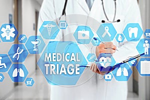 Medical Doctor with stethoscope and MEDICAL TRIAGE sign in Medic photo