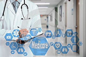 Medical Doctor with stethoscope and Medicare icon in Medical net photo