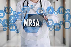 Medical Doctor with stethoscope and word MRSA ,Methicillin-Resistant Staphylococcus Aureus in Medical network connection on the vi photo