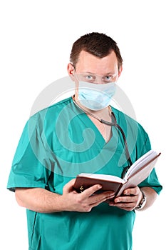 Medical doctor with stethoscope writing