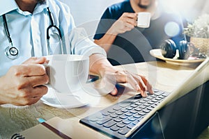 Medical doctor team taking coffee break.using digital tablet doc