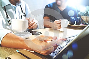 Medical doctor team taking coffee break.using digital tablet doc
